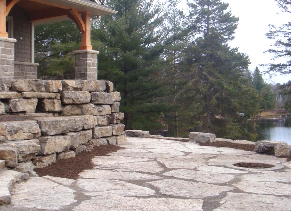 Natural stone steps retaining walls and large flagstone patios